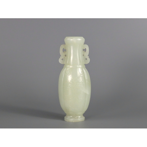 179 - A  Well Carved White Jade Vase, Qianlong/ Jiaqing, of flattened lobed ovoid form, each side decorate... 