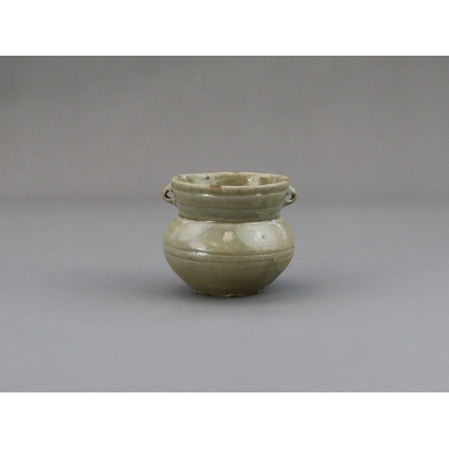 18 - A Yue Celadon-glazed Jar, Eastern Jin dynasty the tapered ovoid body rising to a splayed neck, two b... 