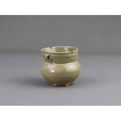 18 - A Yue Celadon-glazed Jar, Eastern Jin dynasty the tapered ovoid body rising to a splayed neck, two b... 