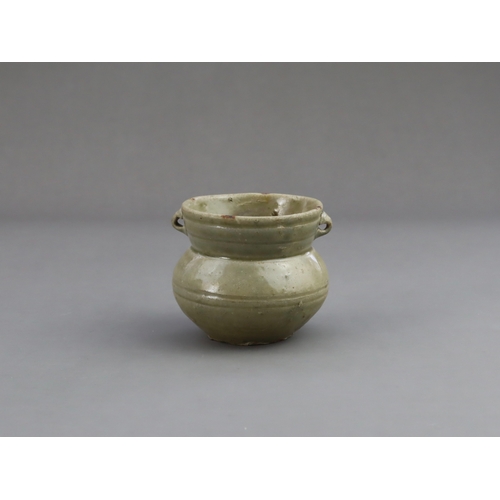 18 - A Yue Celadon-glazed Jar, Eastern Jin dynasty the tapered ovoid body rising to a splayed neck, two b... 