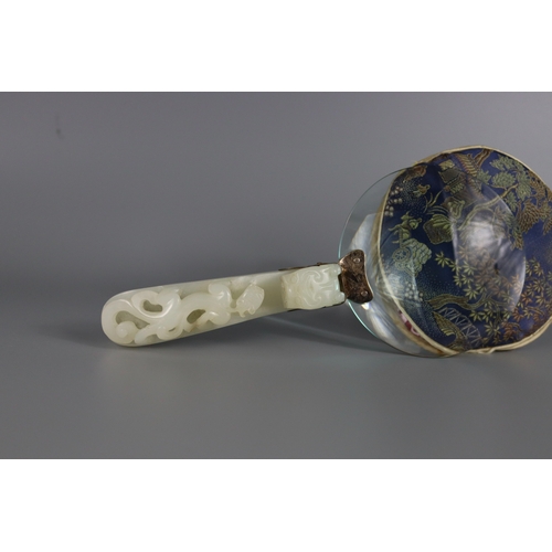 181 - A White Jade Dragon Belthook, mid Qing dynasty, mounted c.1920 as the handle of a magnifying glass, ... 