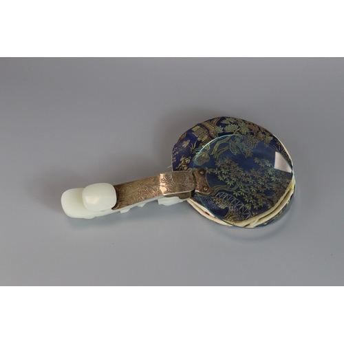 181 - A White Jade Dragon Belthook, mid Qing dynasty, mounted c.1920 as the handle of a magnifying glass, ... 