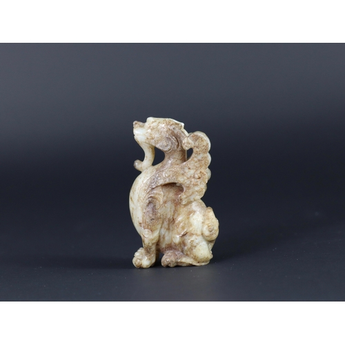 182 - A Winged Fabulous Animal, Ming dynasty,  the alert seated dragon headed beast well carved from a buf... 