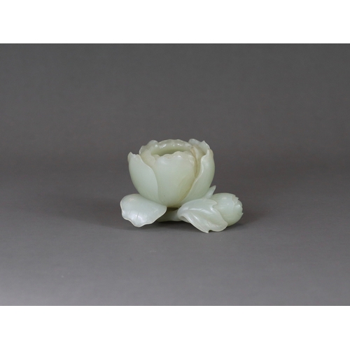 183 - A Pale Celadon Jade Peony Waterpot, 18/19th century,  well carved with the the main bloom opening to... 