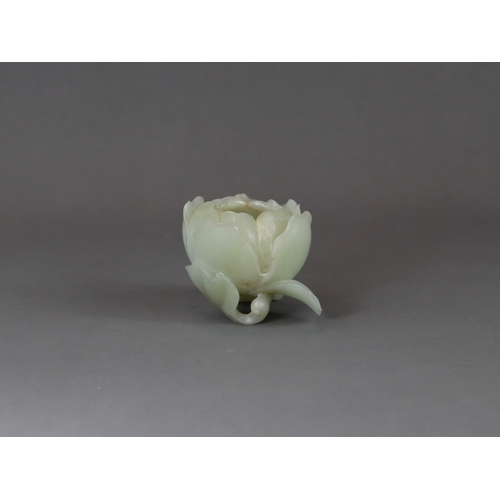 183 - A Pale Celadon Jade Peony Waterpot, 18/19th century,  well carved with the the main bloom opening to... 