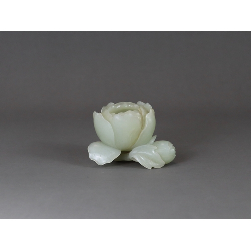 183 - A Pale Celadon Jade Peony Waterpot, 18/19th century,  well carved with the the main bloom opening to... 