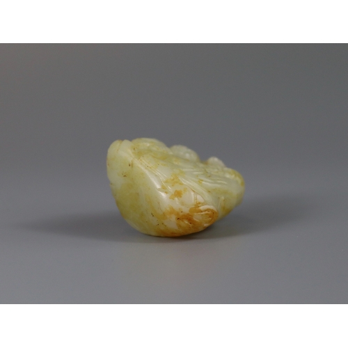 186 - A Good Jade Shoulao Group, Ming dynasty,  the white stone with extensive areas of russet skin, finel... 