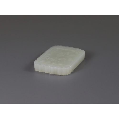 188 - A Fine White Jade Pendant, 19/20th century   the rectangular plaque well carved in low relief on one... 