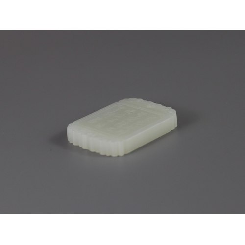 188 - A Fine White Jade Pendant, 19/20th century   the rectangular plaque well carved in low relief on one... 