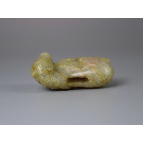 192 - A Jade Seated Horse, 17th century,  softly carved from a greyish celadon stone with faint russet suf... 