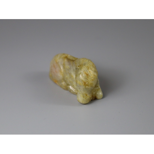 192 - A Jade Seated Horse, 17th century,  softly carved from a greyish celadon stone with faint russet suf... 