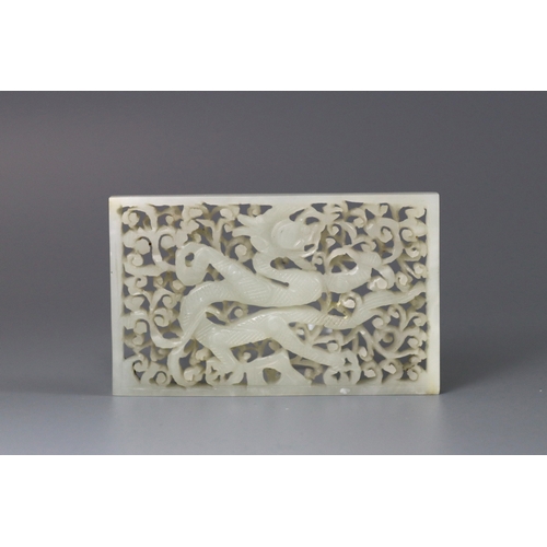 196 - A Good White Jade Dragon Belt Plaque, Ming dynasty, of rectangular form, carved and pierced in low o... 