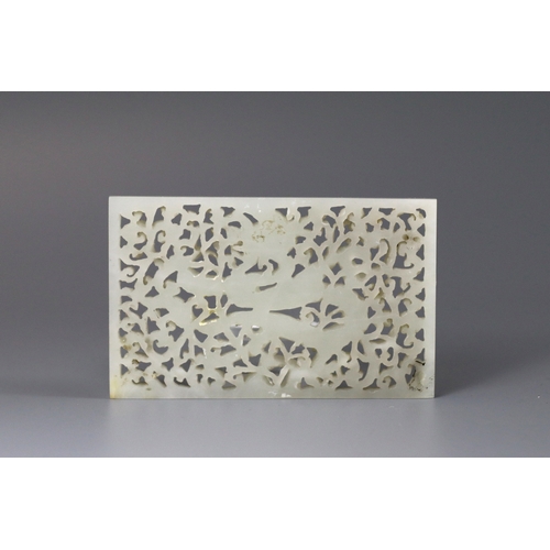 196 - A Good White Jade Dragon Belt Plaque, Ming dynasty, of rectangular form, carved and pierced in low o... 