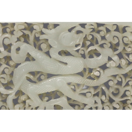 196 - A Good White Jade Dragon Belt Plaque, Ming dynasty, of rectangular form, carved and pierced in low o... 