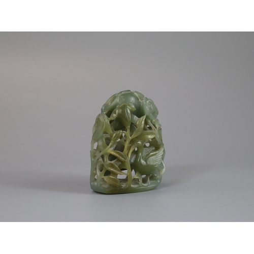 198 - A Sage Green Jade Hat Finial, Yuan/Ming dynasty, well carved from a pebble in deep openwork, with a ... 