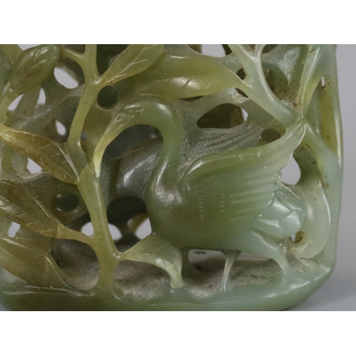 198 - A Sage Green Jade Hat Finial, Yuan/Ming dynasty, well carved from a pebble in deep openwork, with a ... 