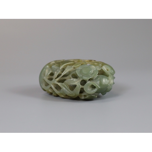 198 - A Sage Green Jade Hat Finial, Yuan/Ming dynasty, well carved from a pebble in deep openwork, with a ... 