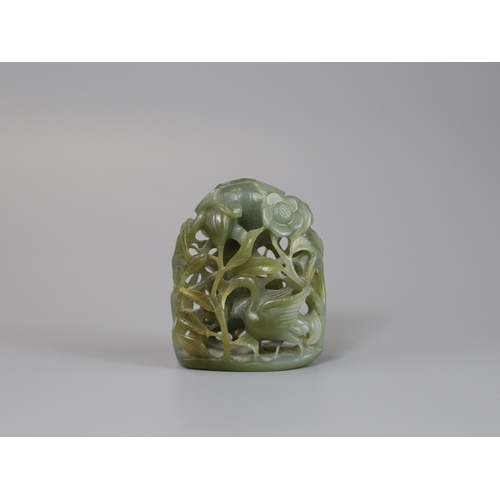 198 - A Sage Green Jade Hat Finial, Yuan/Ming dynasty, well carved from a pebble in deep openwork, with a ... 