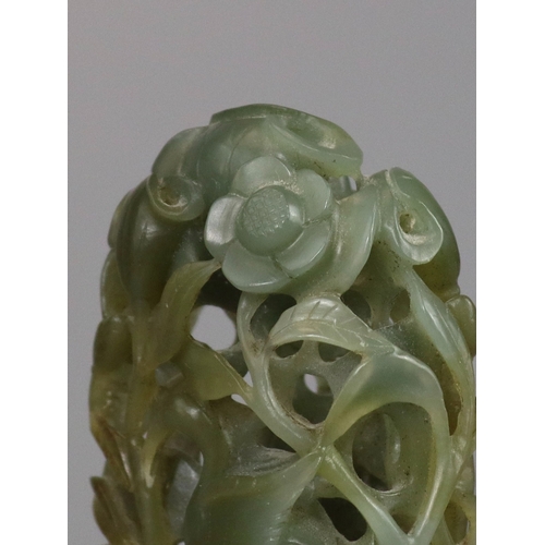 198 - A Sage Green Jade Hat Finial, Yuan/Ming dynasty, well carved from a pebble in deep openwork, with a ... 