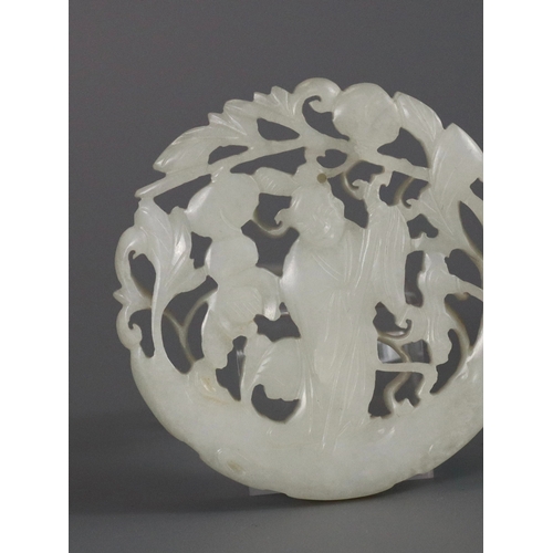 201 - A Pierced White Jade Roundel, 18th century,  carved with a gentleman standing on a curved flowering ... 