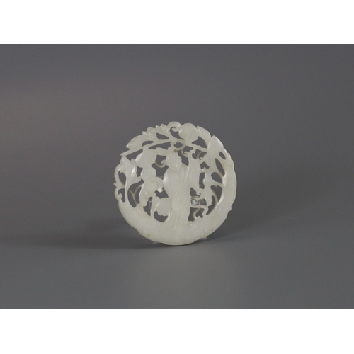 201 - A Pierced White Jade Roundel, 18th century,  carved with a gentleman standing on a curved flowering ... 