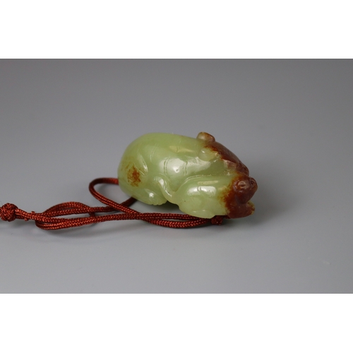 202 - A Jade Cat and Kitten Group, 18th century carved reclining together, in a greenish yellow stone, usi... 