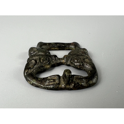 213 - An Ordos Bronze 'Four Overlapping rabbits' Ornament and A 'Double Tiger-head' Belt Buckle, Eastern Z... 