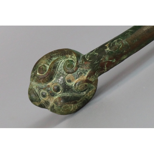 214 - An Archaic Bronze Belthook, Warring States, very finely worked, the bronze with a soft green patina,... 