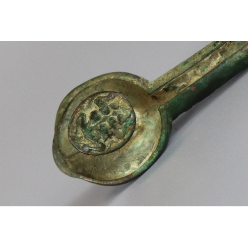 214 - An Archaic Bronze Belthook, Warring States, very finely worked, the bronze with a soft green patina,... 