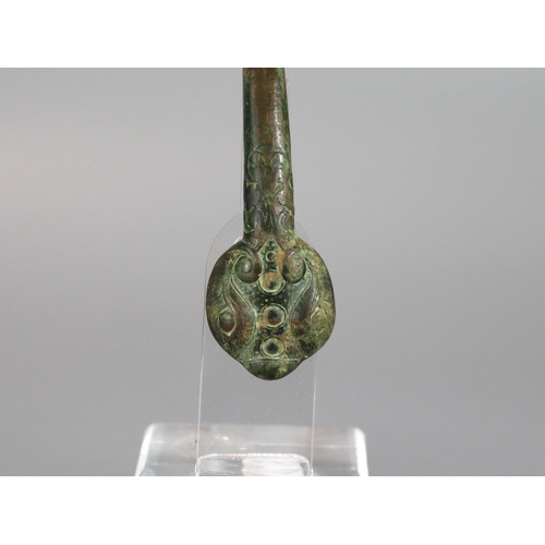 214 - An Archaic Bronze Belthook, Warring States, very finely worked, the bronze with a soft green patina,... 