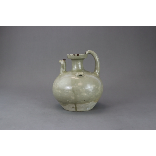 22 - A Yue Celadon Chicken-Head Ewer, Eastern Jin dynasty the globular body with a narrow groove on the s... 