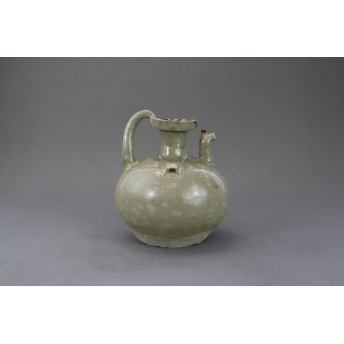 22 - A Yue Celadon Chicken-Head Ewer, Eastern Jin dynasty the globular body with a narrow groove on the s... 