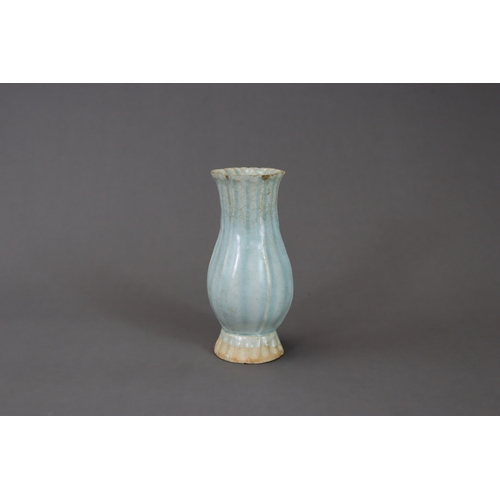 220 - A Moulded Qingbai Lobed Vase, Song dynasty moulded in two pieces from the white ware, the rounded si... 