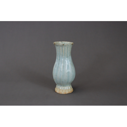 220 - A Moulded Qingbai Lobed Vase, Song dynasty moulded in two pieces from the white ware, the rounded si... 