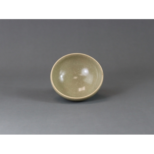 223 - A Longquan Celadon Cup, Song dynasty the rounded sides rising from a tapered foot, applied overall s... 