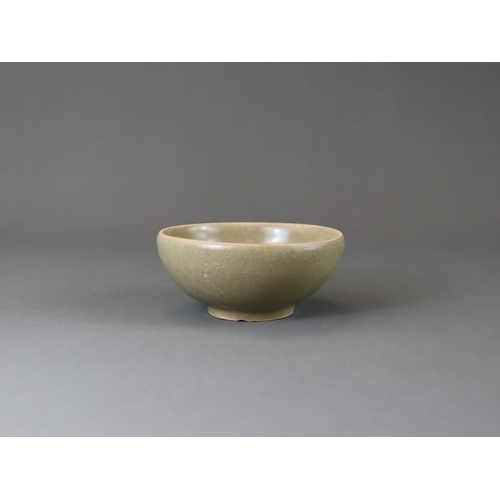 223 - A Longquan Celadon Cup, Song dynasty the rounded sides rising from a tapered foot, applied overall s... 