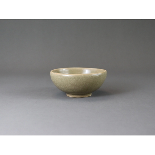 223 - A Longquan Celadon Cup, Song dynasty the rounded sides rising from a tapered foot, applied overall s... 