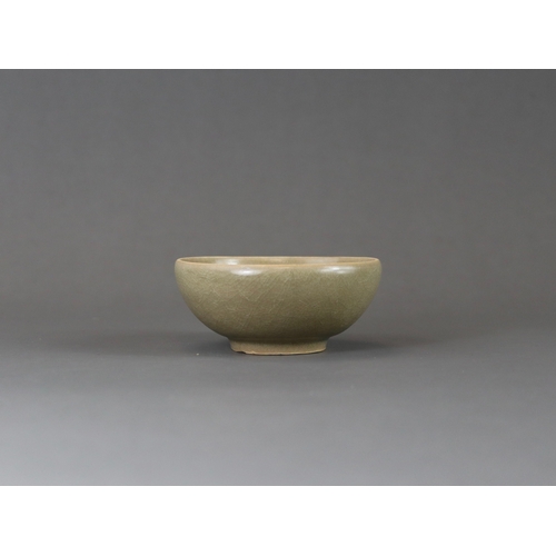 223 - A Longquan Celadon Cup, Song dynasty the rounded sides rising from a tapered foot, applied overall s... 