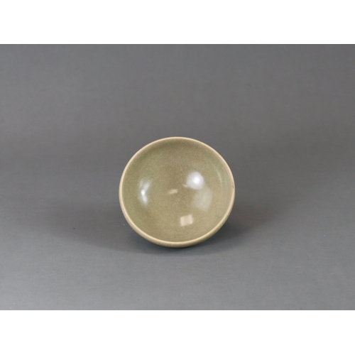 223 - A Longquan Celadon Cup, Song dynasty the rounded sides rising from a tapered foot, applied overall s... 