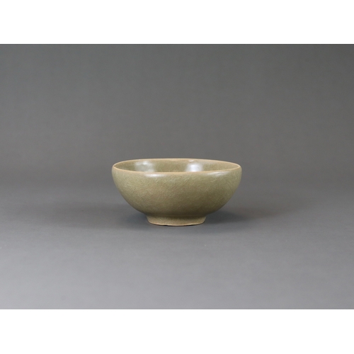 223 - A Longquan Celadon Cup, Song dynasty the rounded sides rising from a tapered foot, applied overall s... 