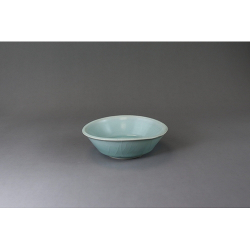 224 - A Longquan Celadon Brushwash, Song dynasty with straight flared sides rising at an angle from a tape... 