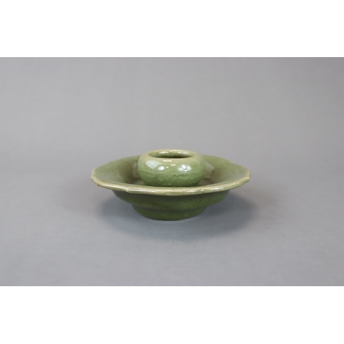 226 - A Longquan Celadon Cupstand, Yuan dynasty heavily potted, the raised cup holder with curved sides ab... 