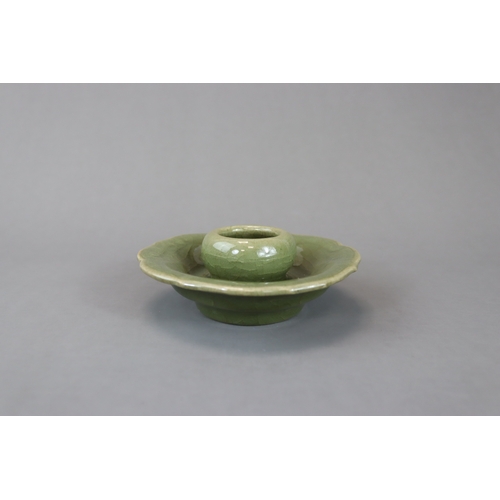 226 - A Longquan Celadon Cupstand, Yuan dynasty heavily potted, the raised cup holder with curved sides ab... 