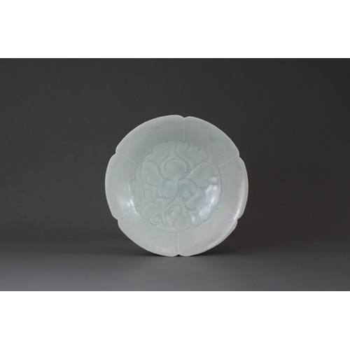 227 - A Qingbai Lobed Peony Dish, Song dynasty the wide everted rim divided into six lobes, freely carved ... 