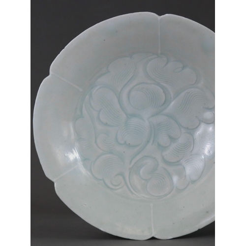 227 - A Qingbai Lobed Peony Dish, Song dynasty the wide everted rim divided into six lobes, freely carved ... 