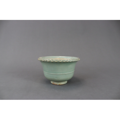 228 - A Longquan Celadon Jardiniere, Yuan dynasty the short, splayed foot supporting the  rounded bowl, wi... 