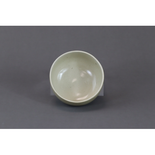 229 - A Ding-type White-glazed Bowl and Cover, Song dynasty the deep, slightly incurved walls supported on... 