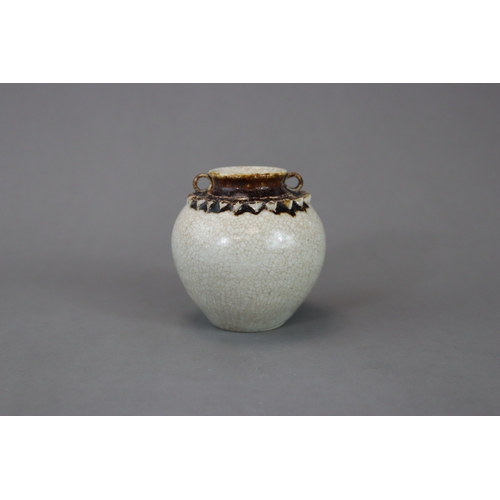 23 - A Rare Vietnamese Celadon Jar, 13/14th century nicely potted and covered overall in a straw glaze, t... 