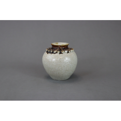 23 - A Rare Vietnamese Celadon Jar, 13/14th century nicely potted and covered overall in a straw glaze, t... 