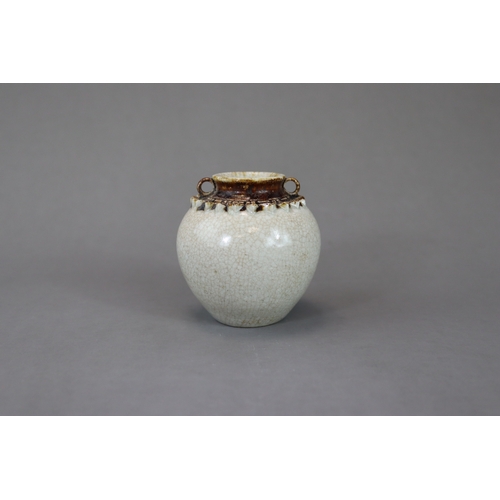 23 - A Rare Vietnamese Celadon Jar, 13/14th century nicely potted and covered overall in a straw glaze, t... 